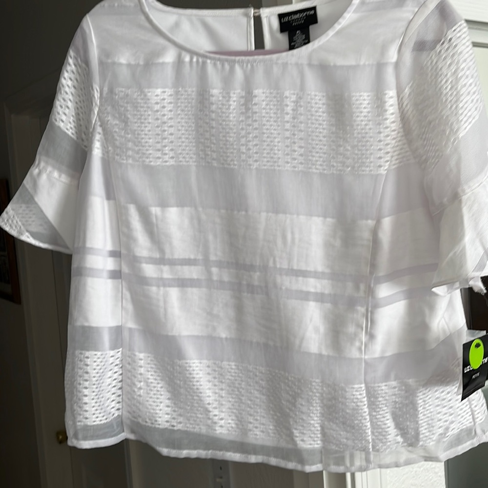 This is a Liz Claiborne career petite, made of 77%r rayon and 23%. Nylon